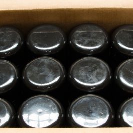 A pack of black containers in a carton